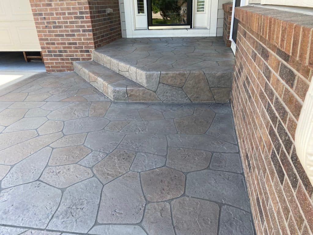 Hand-troweled flagstone concrete entryway and steps