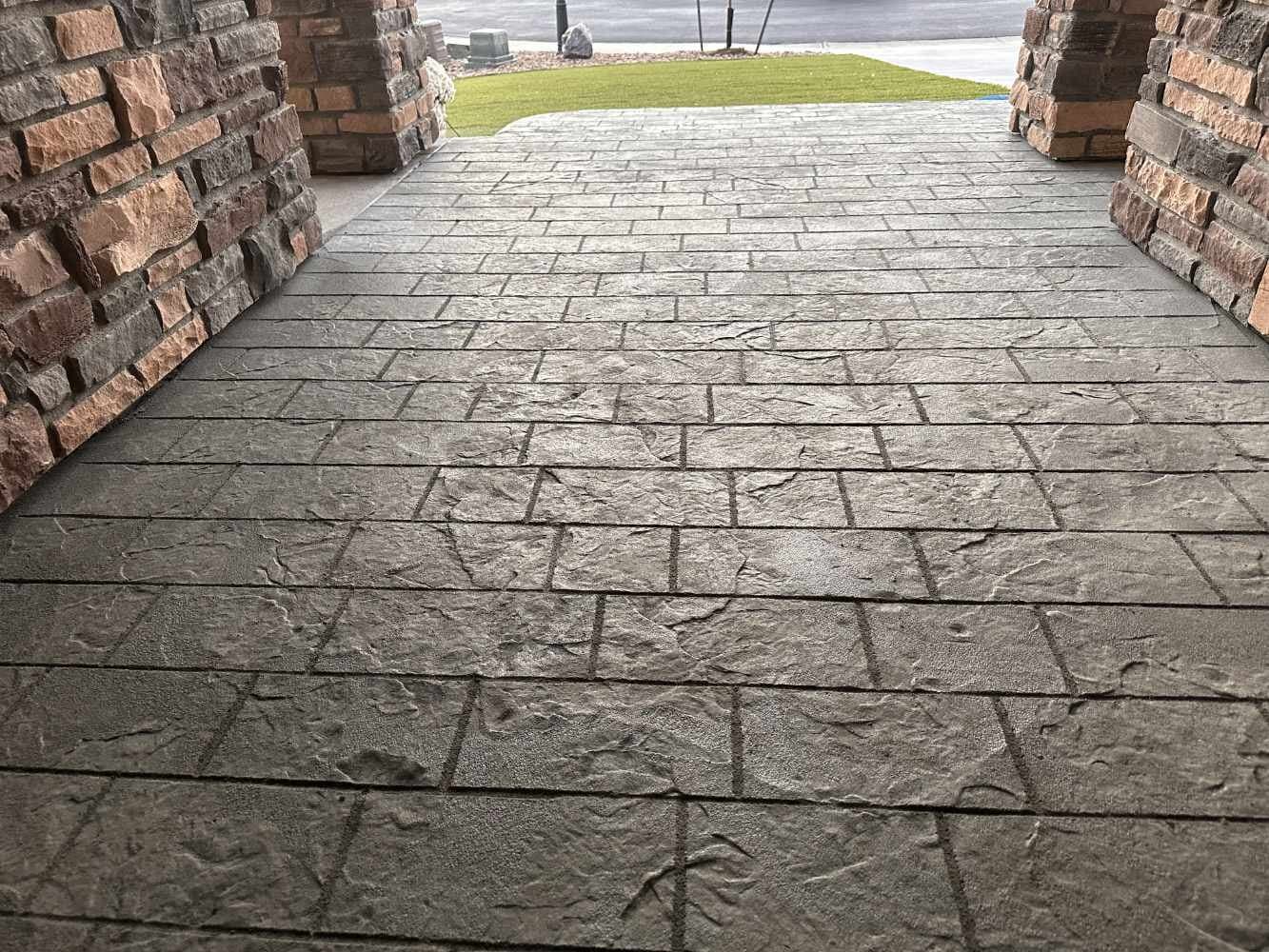 Ashlar slate walkway between stone columns