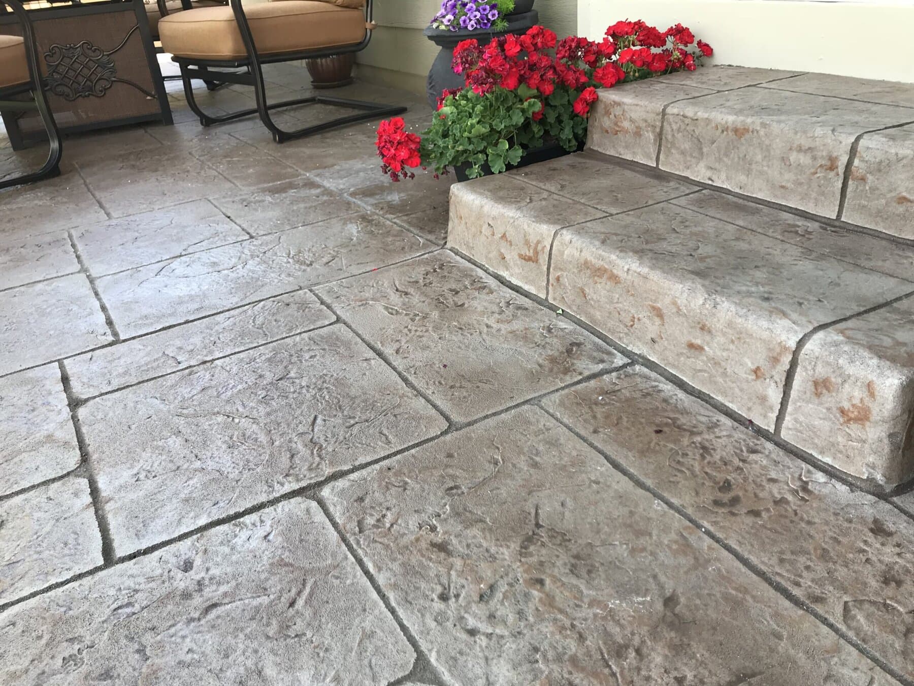 Stamped patio and steps with planted borders
