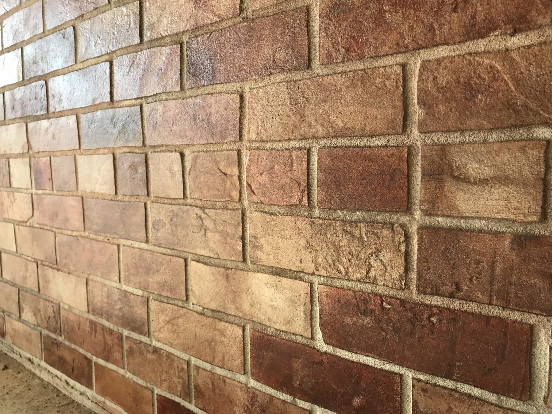 Hand-carved brick texture on a vertical wall