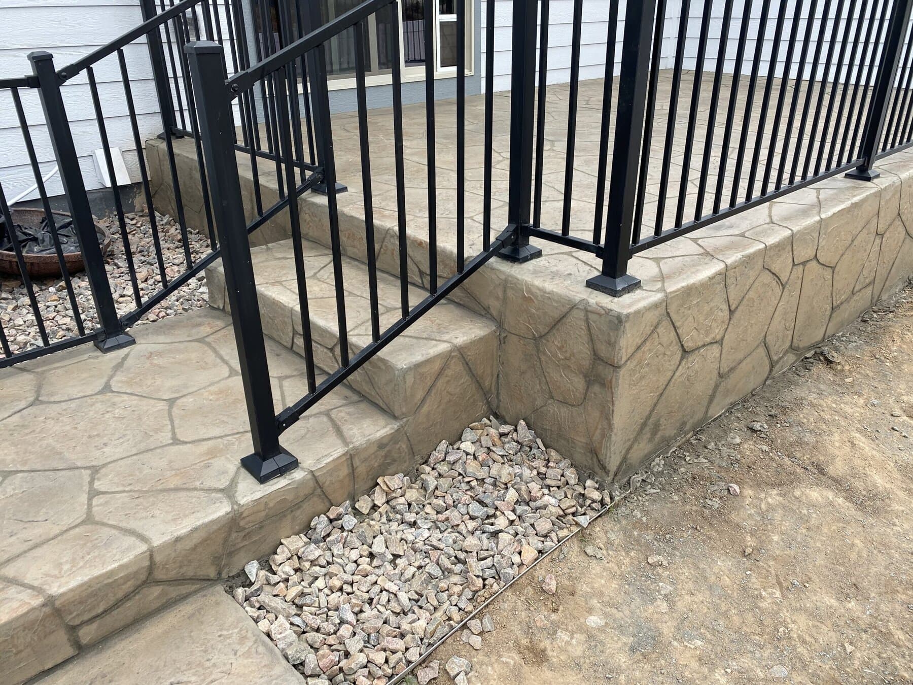 Flagstone steps and landing with railing