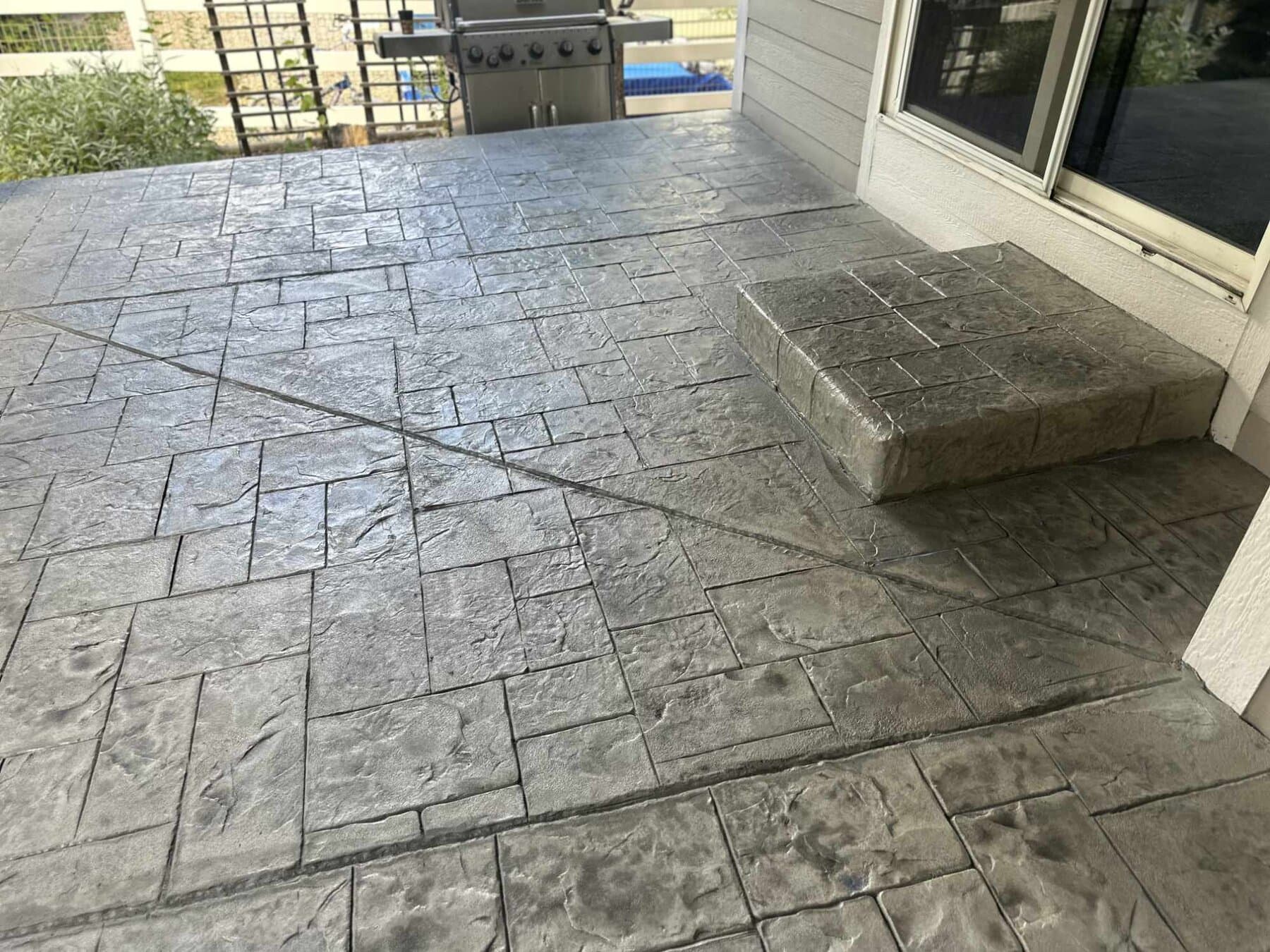 Slate-pattern stamped patio and step