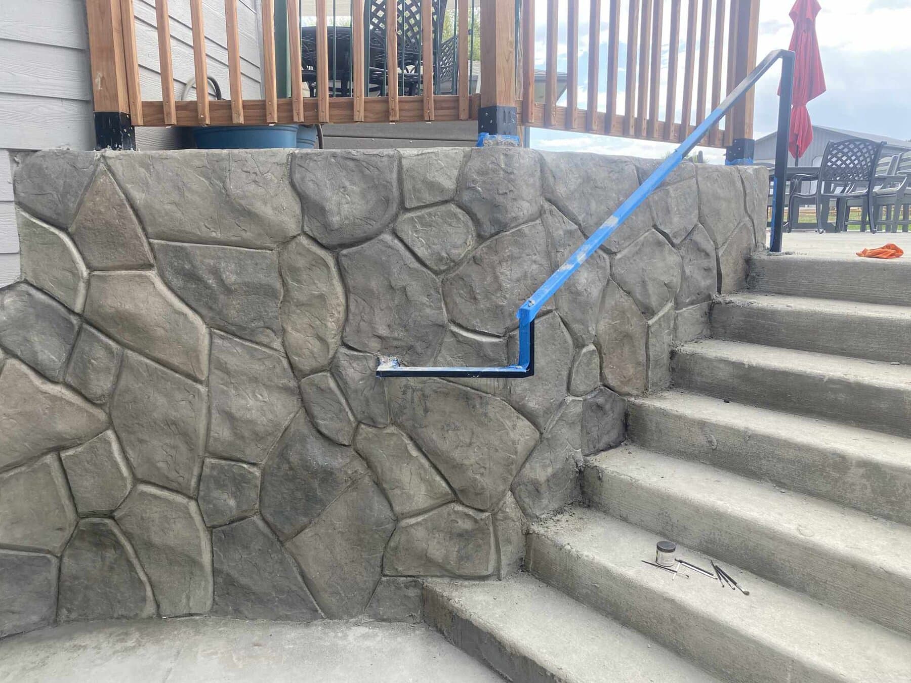 Hand-carved stone wall alongside new steps