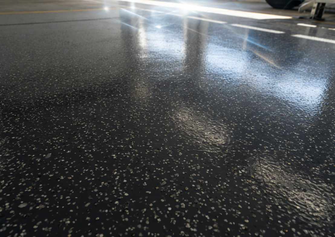 High-gloss decorative flake epoxy floor catching the light